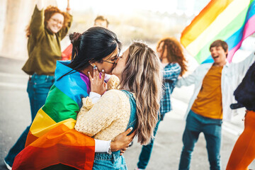 Diverse group of young people celebrating gay pride festival day - Lgbt community concept with two...