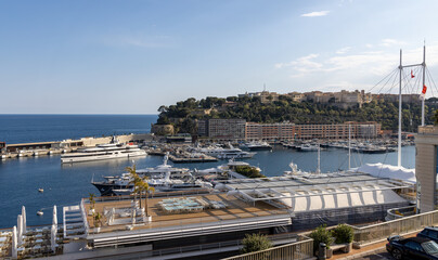 View of the Monte-Carlo marina, Monaco in spring with yachts and sailing ships and the palace