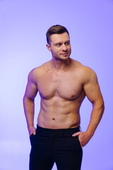 Fototapeta premium Sexy portrait of handsome topless male model. Strong muscular man with shirtless body.