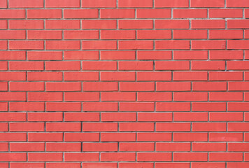 Brick wall painted in pastel pink color as a background