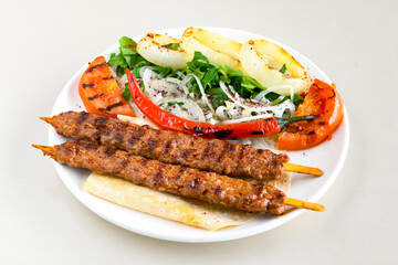 Beef steak grill with rice pilaf, fried potatoes, grilled pepper and tomatoes.Mix Platter with Beef rips, Cutlets, Potatoes and Sauces.