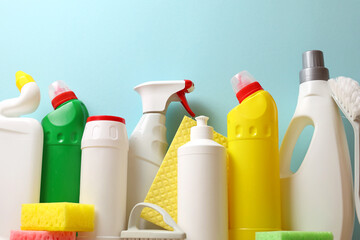 A set of different cleaning and disinfectant products on a coloured background