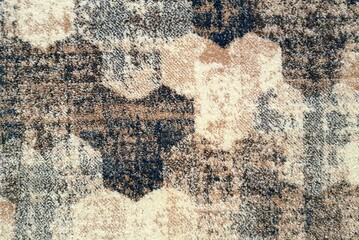Fluffy old carpet with geometric pattern background texture, close up