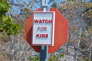Watch for kids road safety sign red and white