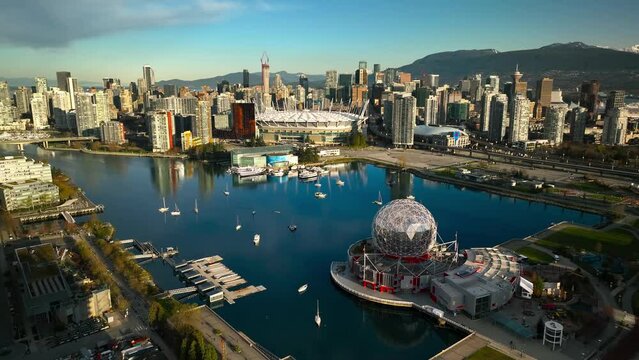 Vancouver city centre at false creek with B.C. Place and Science World with skyline and skyscrapers in background