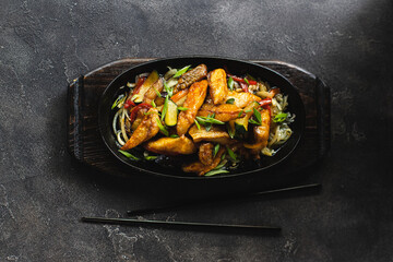 Appetizing grilled vegetables sprinkled with herbs in a flat pan