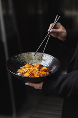 Stylish serving of food in the restaurant. Serving. Waiter