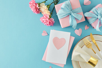 Joyful Mother's Day mood concept. Top view photo of envelope postcard, gift boxes, plate, cutlery, carnation flowers and paper hearts on blue background. Flat lay with empty space for greeting