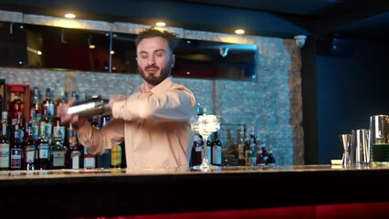 The profession of bartender. The process of making a cocktail at a bar in a restaurant. the bartender mixes the ingredients of an alcoholic cocktail by shaking a shaker.