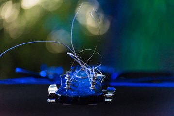 an electric guitar with the strings in the air, background to promote show