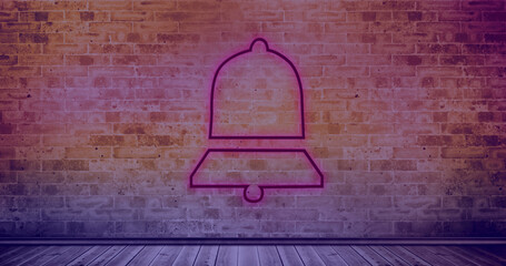 Composition of bell icon over brick wall