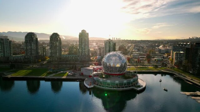 Sunrise over False Creek and Science World in Vancouver, Canada, orange sunrise
