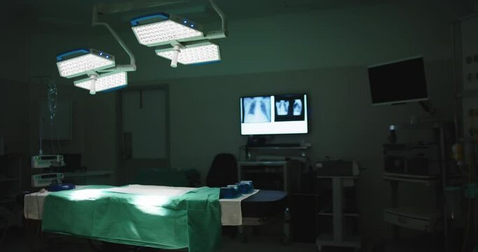 General view of empty operating room with bed and xrays in slow motion