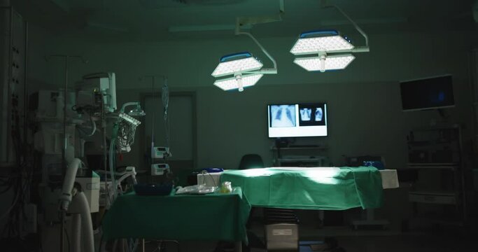 General view of empty operating room with bed and xrays in slow motion