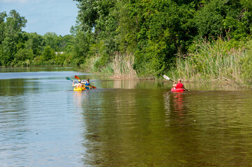 Fototapeta na wymiar Kayaks On The River In Summer
