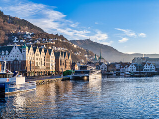 Bryggen colorful timber buildings, a shot from fjord, Bergen old wharf, Norway