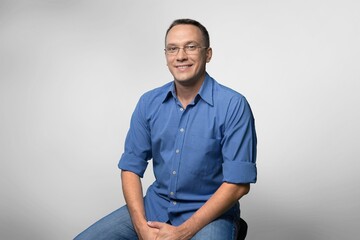 Obraz premium Young happy handsome man posing