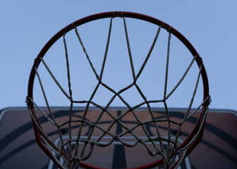 basketball hoop against blue sky © NAK