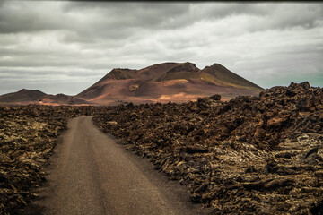 Amazing panoramic landscape of volcano in Timanfaya national park. Popular touristic in Lanzarote island Canary islans Spain. Artistic picture. Travel concept © Elena