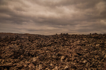 Obraz premium Amazing panoramic landscape of volcano in Timanfaya national park. Popular touristic in Lanzarote island Canary islans Spain. Artistic picture. Travel concept