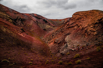 Amazing panoramic landscape of volcano in Timanfaya national park. Popular touristic in Lanzarote island Canary islans Spain. Artistic picture. Travel concept