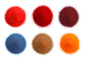 Heaps of different powdered food coloring isolated on white, top view