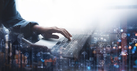 Digital marketing, IoT Internet of Things, Internet communication technology, business plan and strategy concept. Businessman using laptop computer with market research and smart communication icons