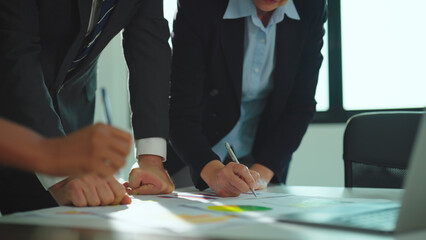 Close-up shot, People working at office. They writing business idea or Business plan together at modern office.