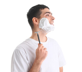 Young man shaving against white background