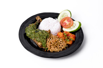 Rice with spicy fried chicken and vegetables on white background