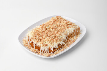 toasted bread topped with cheese slices and nuts