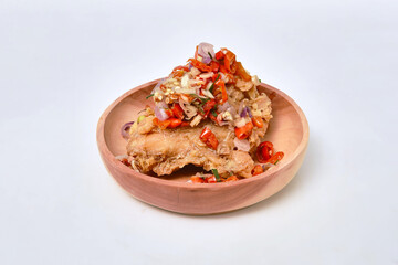 fried chicken and chilli sauce in wooden bowl on white background