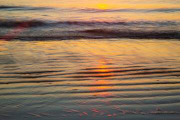 USA, Georgia, Tybee Island. Sunrise with ripples in the sand