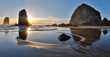 USA, Oregon. Cannon Beach with Haystack near sunset and low tide.