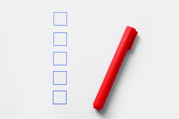 Checklist box with red marker, closeup