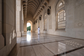 Fototapeta na wymiar Empty corridor of Sultan Qaboos Grand Mosque, Muscat, Oman