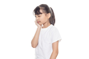 Young Asian girl touching mouth with hand with painful expression because of toothache or dental illness on teeth. Dentist concept.
