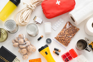 Necessities for emergency bag on white table