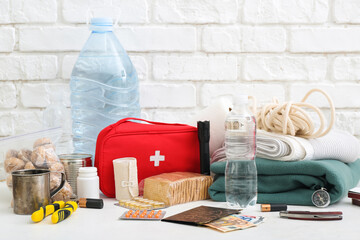 Necessities for emergency bag on white table