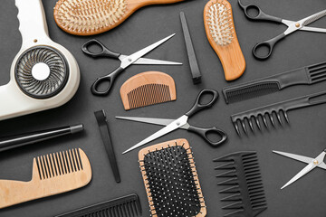 Composition with hairdressing accessories on black background