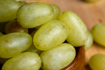 Ripe green grapes on the kitchen table