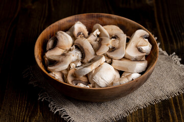 Peeled, washed and cut mushrooms champignons during cooking