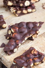 large pieces of milk chocolate with roasted hazelnuts
