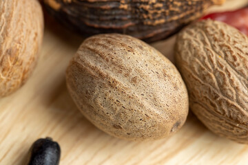 A whole nutmeg fruit on the kitchen table