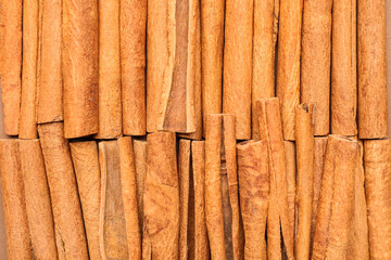 Cinnamon sticks as background, closeup