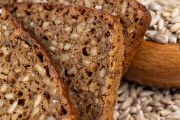 Black rye bread cut into chunks with sunflower seeds