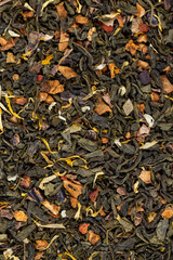 fresh green tea with pieces of fruit and berries