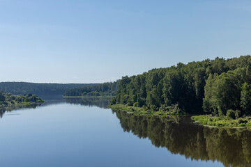 Obraz na płótnie Canvas Wide river in summer in sunny weather