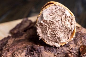 chocolate ice cream in a waffle cup on chocolate