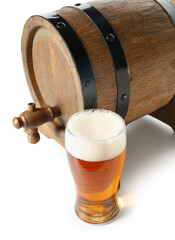 Wooden barrel and glass of cold beer on white background